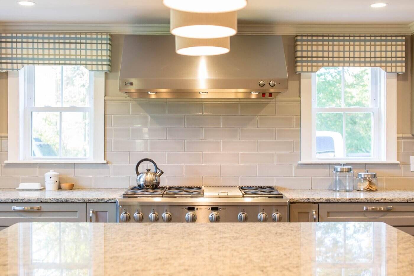 Top Tips to Make an Eco-Friendly Kitchen 2 kitchen with stove and two windows - top tips to make an eco-friendly kitchen