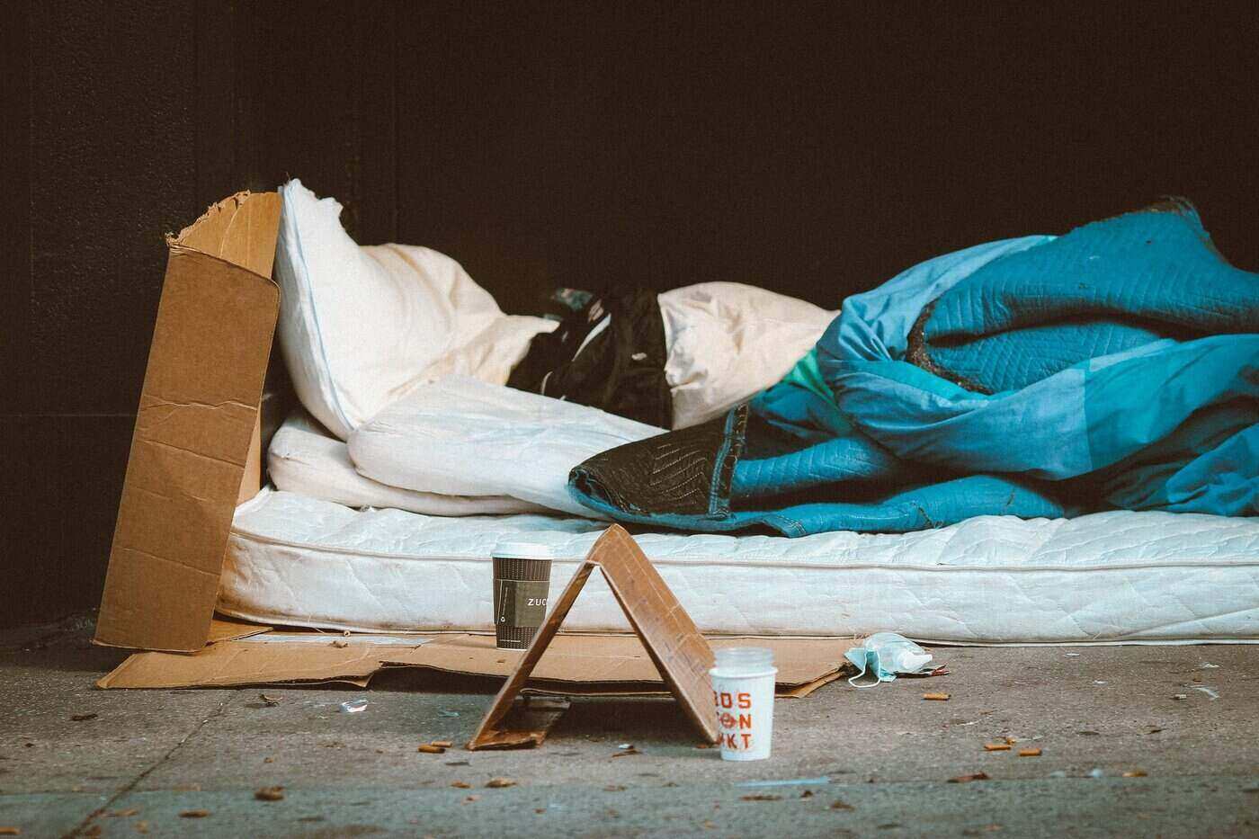 Tiny Home Village Provides Solutions for Kingston Veterans 2 sleeping bag on sidewalk - tiny home village - solution for kingston veterans