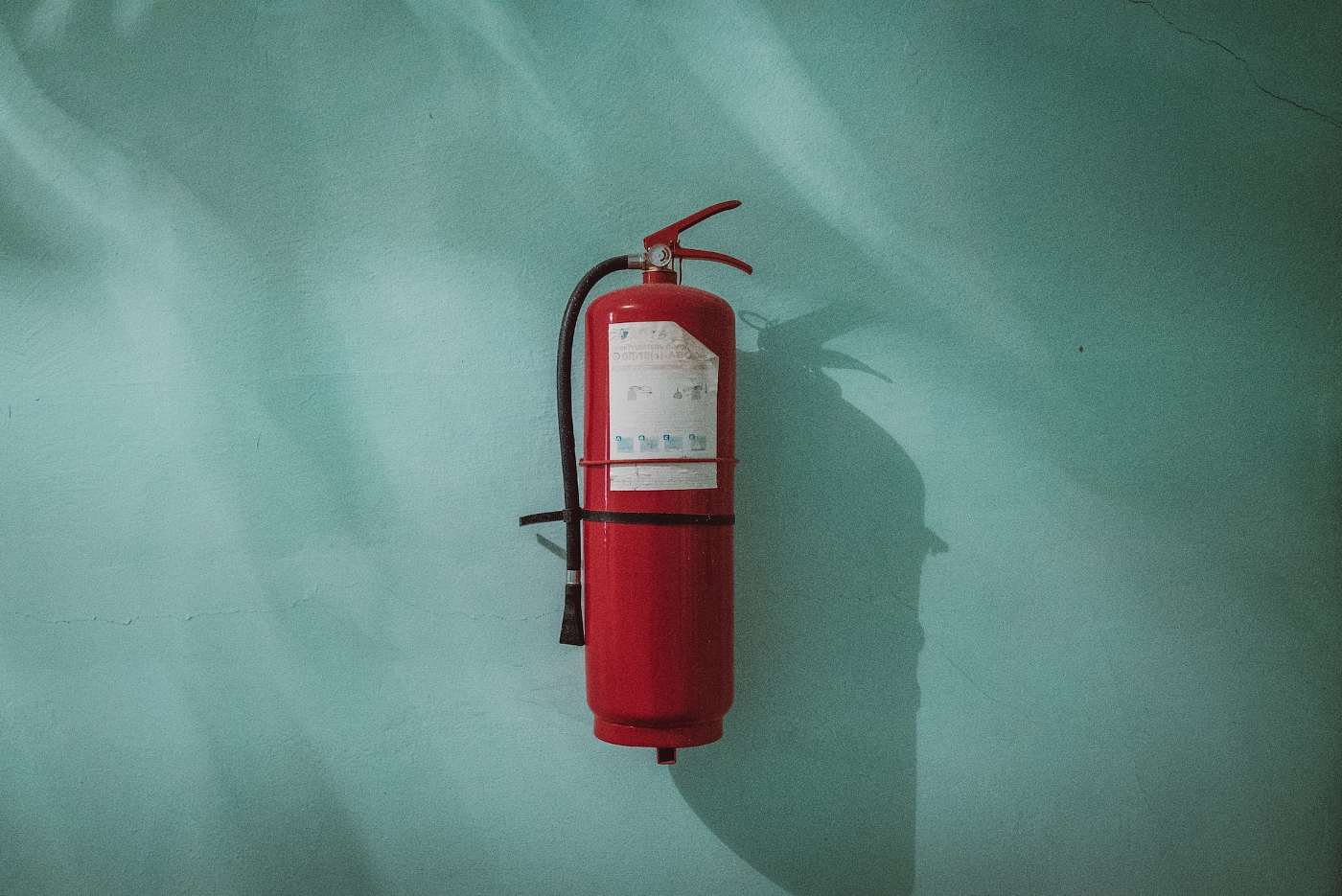 How Eco-Friendly is Fire Safety Equipment? 2 fire extinguisher against green wall - how eco-friendly is fire safety equipment