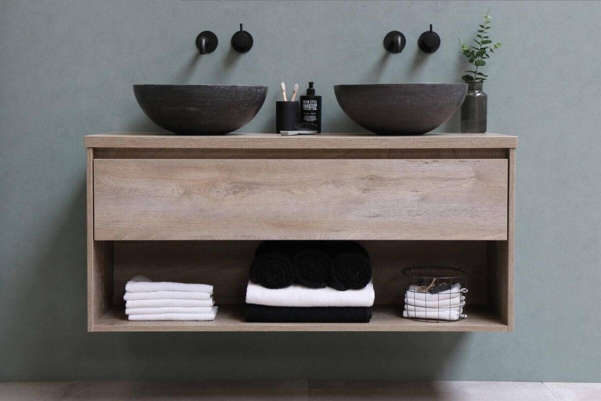 dual sink with open shelf of black and white towels - bathroom renovation basics
