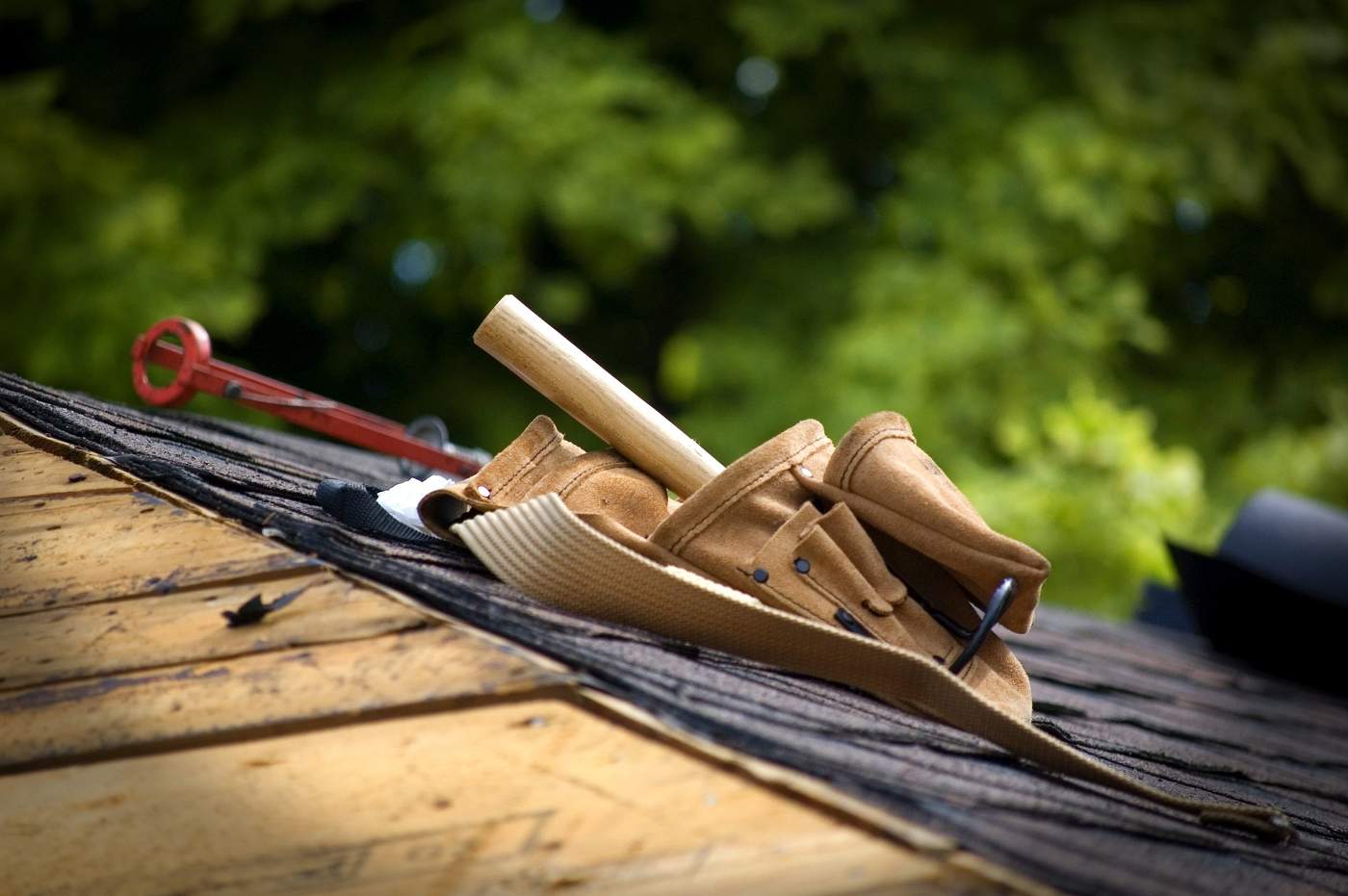 Popular Building Methods and Their Environmental Emissions 2 tool belt on roof - building methods and environmental emissions