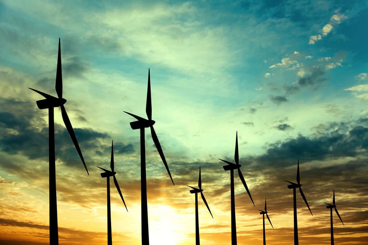 In a Major Policy Reversal, Doug Ford Now Pushing for Renewable Energy in Ontario 2 wind turbines at sunset