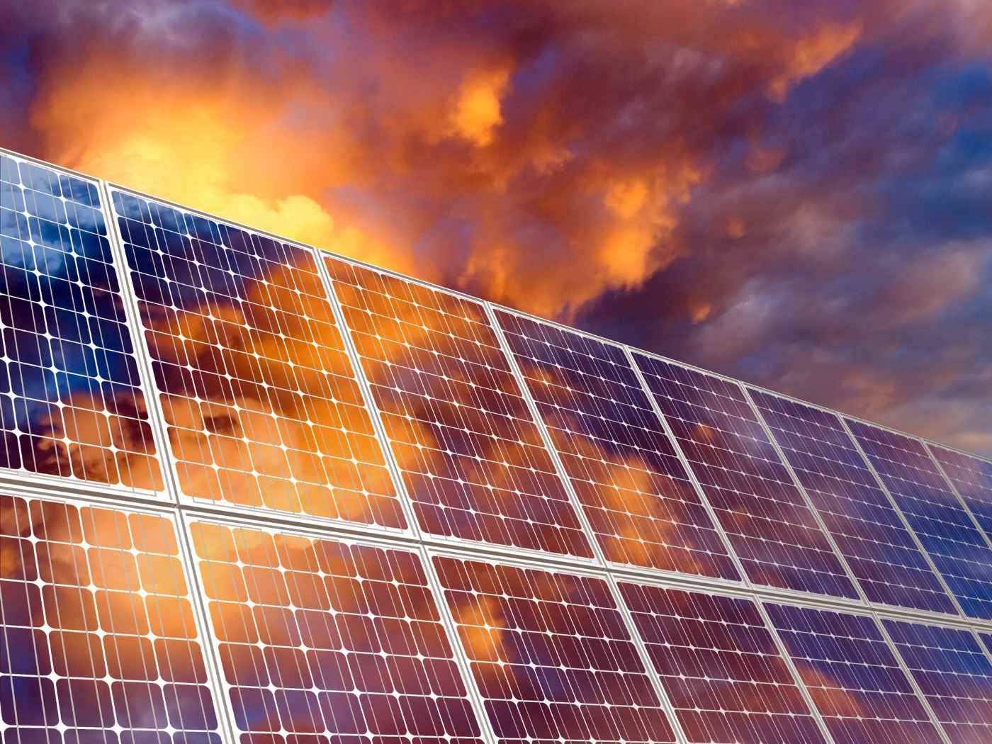 7 Different Ways Solar Panels Are Used in Everyday Life 1 Solar panels as sun is setting - Essential Tools: 7 Ways Solar Panels Can Improve Your Life