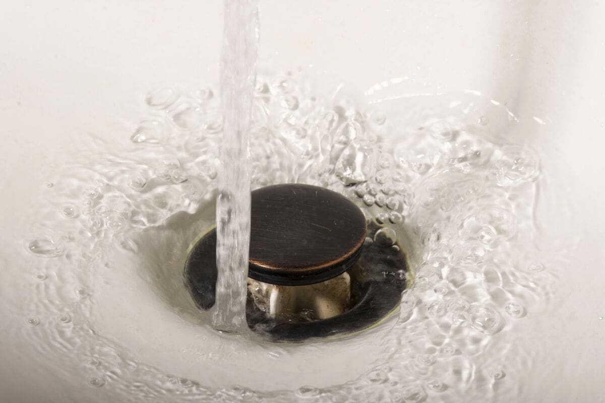 How Drain Water Heat Recovery Systems Turn Wastewater Into Energy Savings 1 water going down drain