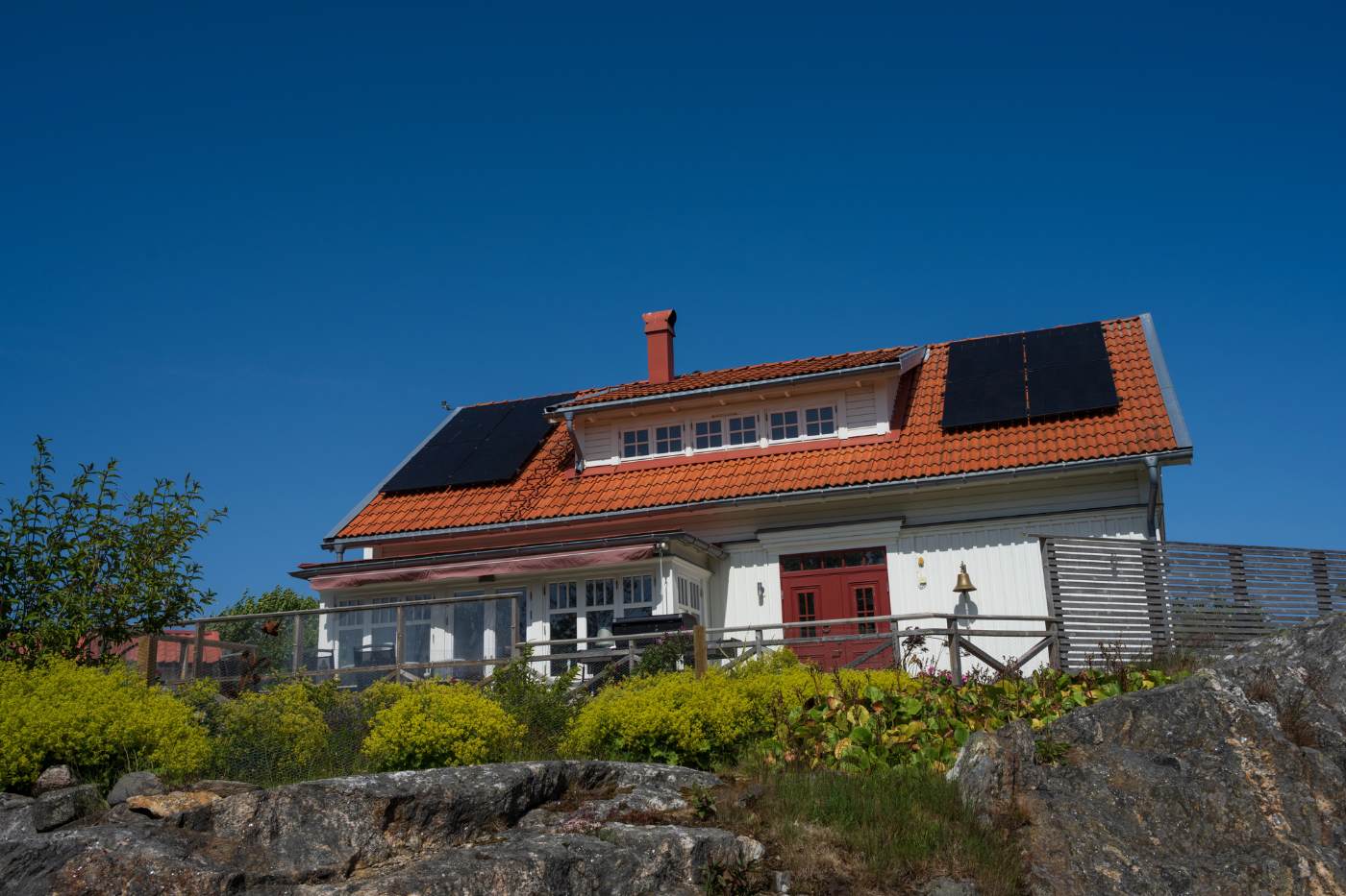Average Cost of Solar Panels in Nova Scotia 7 Solar panels on red roof - Average Cost of Solar Panels in Nova Scotia