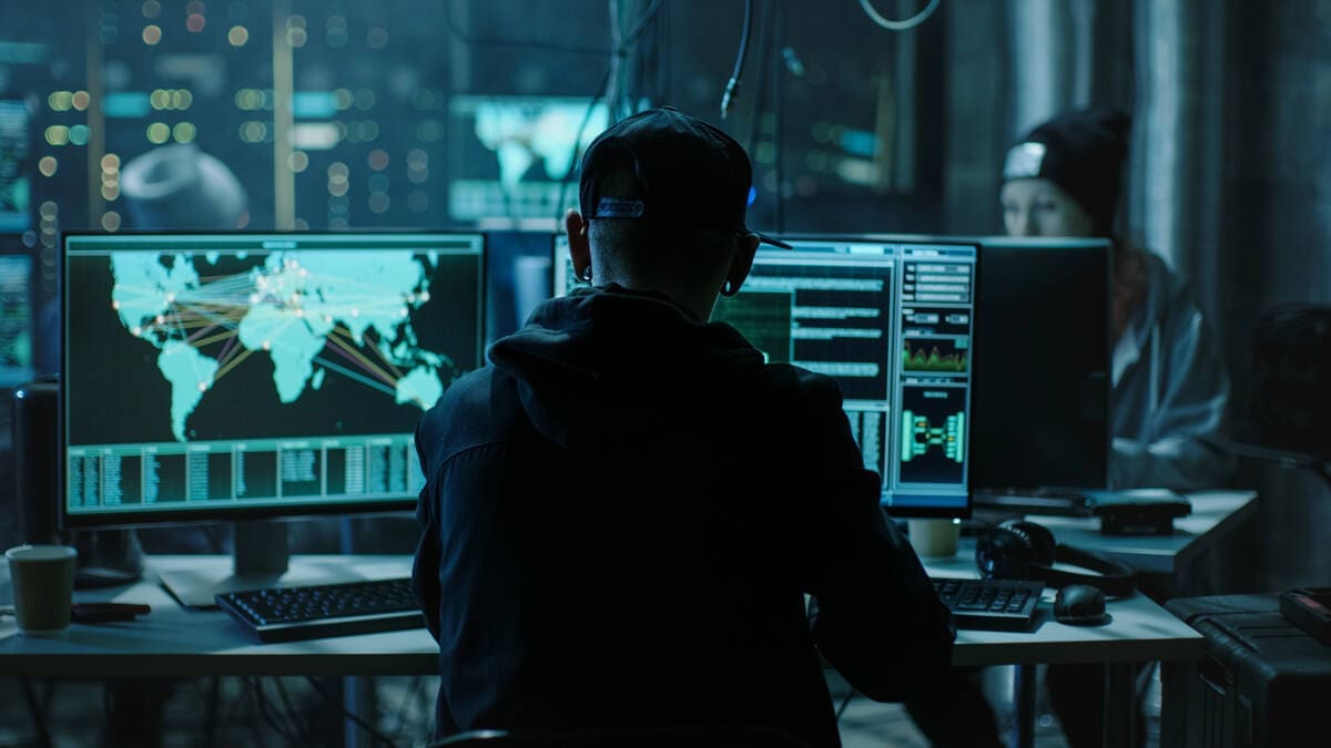 How to Develop Digital Resilience for Your Home or Commercial Building 7 hacker on internet doing cyber attack on buildings