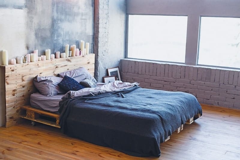 DIY Platform Bed: Create Your Own Queen-Sized Bed from Reclaimed Pallets 9 Low platform bed with wood bolsters - DIY platform bed