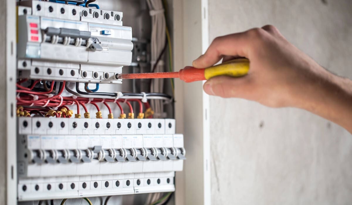 Before You Go All-Electric: What to Know About Your Home’s Wiring 1 electrician wiring electrical panel