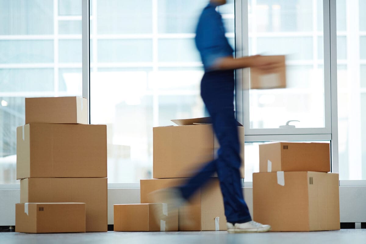 How to Relocate an Office Sustainably 1 mover moving things - business relocation in progress