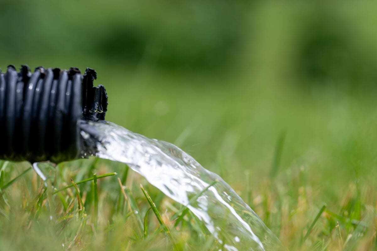 How Can I Protect My Home from Flooding? 1 pipe draining from sump pump